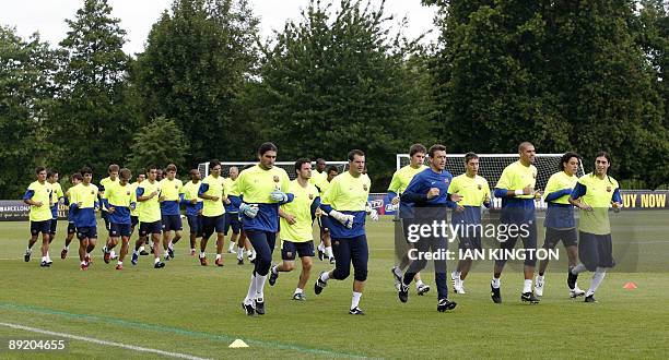 The Barcelona squad in action during a team training session at Bisham Abbey Sports Centre in Marlow, in southern England, on July 23, 2009....
