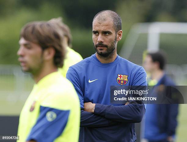 Barcelona's manager Josep Guardiola is pictured during a team training session at Bisham Abbey Sports Centre in Marlow, in southern England, on July...