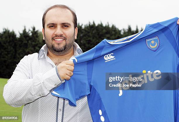 Portsmouth Chairman Sulaiman Al Fahim holds his team's new home shirt for the 2009/2010 season with Jobsite as the new shirt sponsor at the club's...