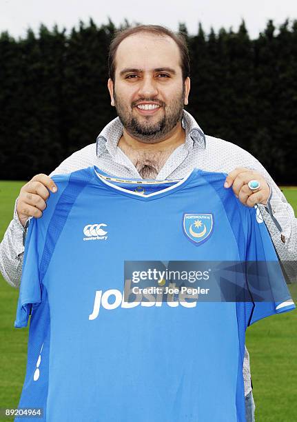 Portsmouth Chairman Sulaiman Al Fahim holds his team's new home shirt for the 2009/2010 season with Jobsite as the new shirt sponsor at the club's...