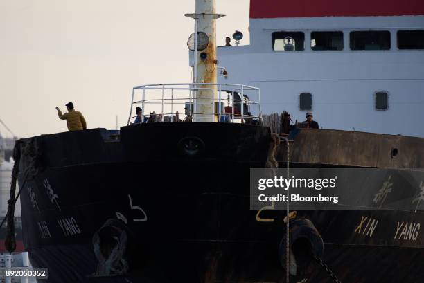 The crew work on a ship off the Keihin industrial area of Kawasaki, Kanagawa Prefecture, Japan, on Tuesday, Dec. 12, 2017. The Bank of Japan will...