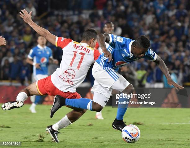 Duvier Riascos of Millonarios fights for the ball with Anderson Plata of Independiente Santa Fe during the first leg match between Millonarios and...