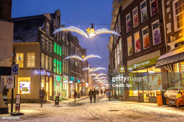 shopping street in zwolle during a cold winter night - zwolle stock pictures, royalty-free photos & images