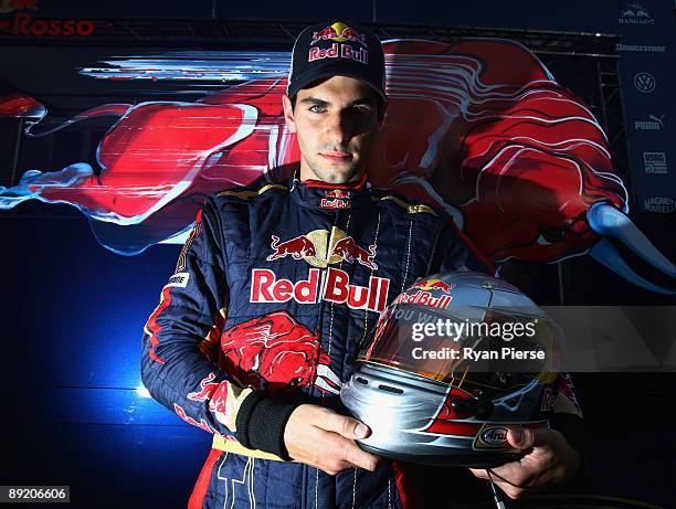 Jaime Alguersuari of Spain and Scuderia Toro Rosso poses for a photograph in the paddock during previews to the the Hungarian Formula One Grand Prix...
