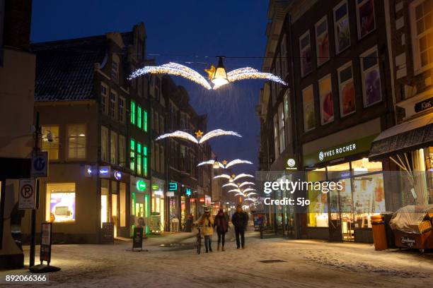 shopping street in zwolle during a cold winter night - zwolle stock pictures, royalty-free photos & images