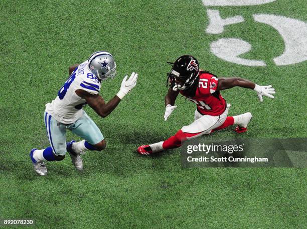 Dez Bryant of the Dallas Cowboys runs with a catch against Desmond Trufant of the Atlanta Falcons at Mercedes-Benz Stadium on November 12, 2017 in...