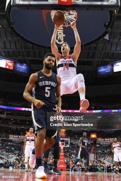 Washington Wizards forward Jason Smith scores on a first half dunk against Memphis Grizzlies guard Andrew Harrison on December 13, 2017 at the...