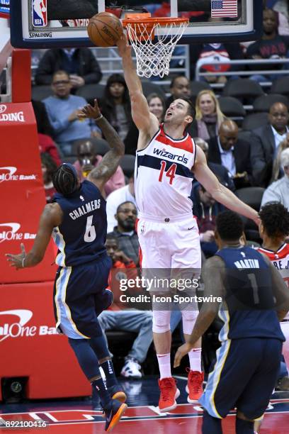 Washington Wizards forward Jason Smith blocks the shot of Memphis Grizzlies guard Mario Chalmers on December 13, 2017 at the Capital One Arena in...