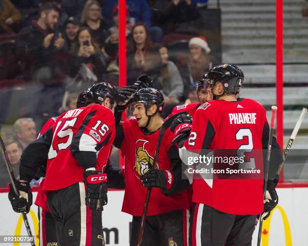 Ottawa Senators Left Wing Zack Smith celebrates with Ottawa Senators Center Jean-Gabriel Pageau and Ottawa Senators Defenceman Dion Phaneuf after...