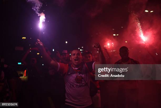 Fans of Flamengo light torches and shout slogans as they support their team ahead of the 2017 Sudamericana Cup championship final match between...