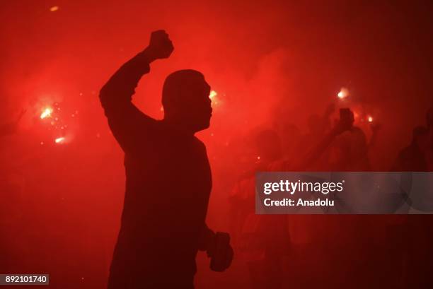 Fans of Flamengo light torches and shout slogans as they support their team ahead of the 2017 Sudamericana Cup championship final match between...