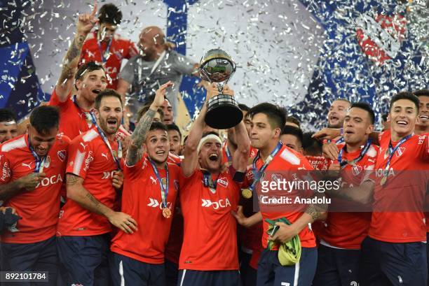 Independiente player Walter Erviti rears the Cup and celebrates the victory with his teammates after the 2017 Sudamericana Cup championship final...