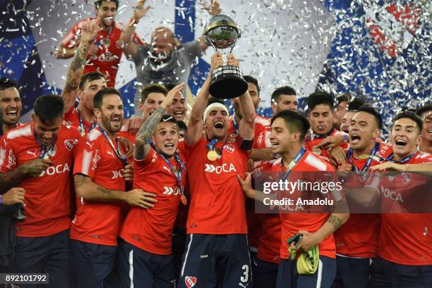 Independiente player Walter Erviti rears the Cup and celebrates the victory with his teammates after the 2017 Sudamericana Cup championship final...