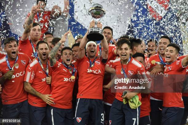 Independiente player Walter Erviti rears the Cup and celebrates the victory with his teammates after the 2017 Sudamericana Cup championship final...