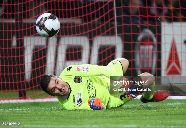 Goalkeeper of OGC Nice Yoan Cardinale stops a penalty during the penalty shootout of the French League Cup match between Lille OSC and OGC Nice at...