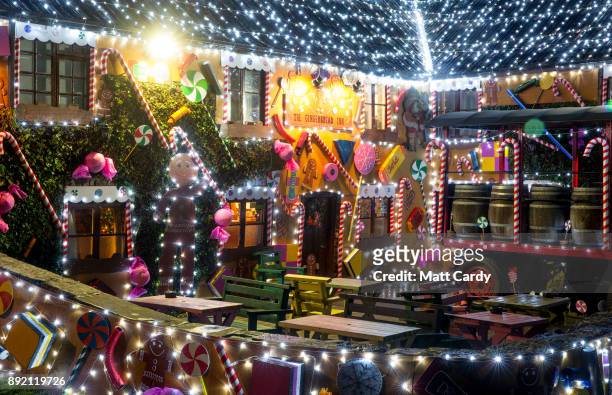 Lights illuminate the Queen Victoria Inn in the village of Priddy that has been transformed into a giant gingerbread house in time for Christmas,...