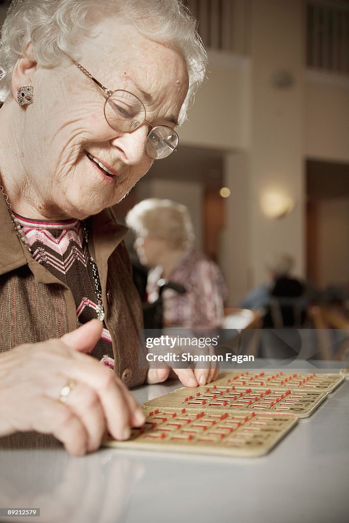 Elderly Woman Playing Games in Retirement Home