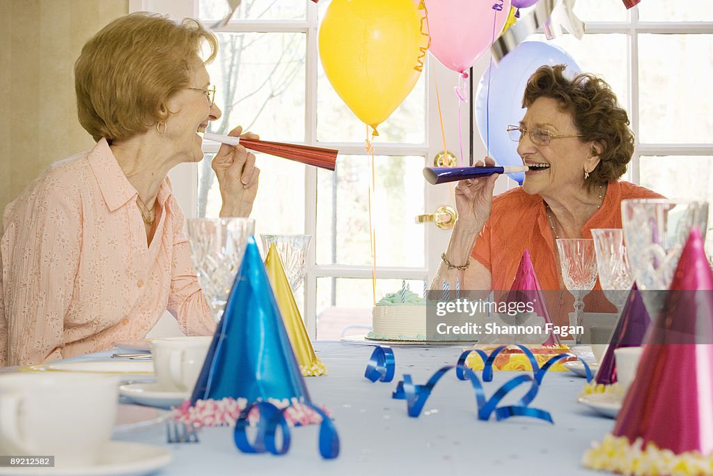 Elderly Women at Birthday Party Celebrating