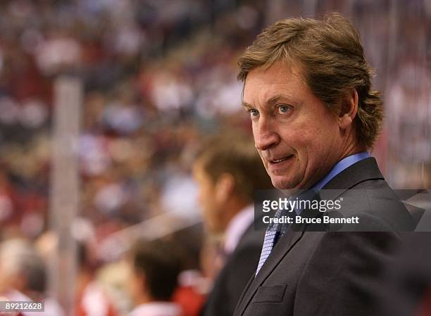 Head Coach Wayne Gretzky of the Phoenix Coyotes manages his team from behind the bench during his game against the St. Louis Blues on February 28,...
