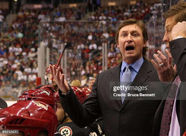 Head Coach Wayne Gretzky of the Phoenix Coyotes manages his team from behind the bench during his game against the St. Louis Blues on February 28,...