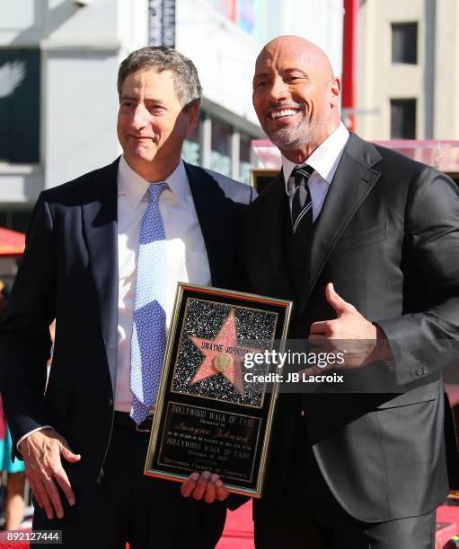 Tom Rothman, Chairman of Sony Entertainment's Motion Picture Group and actor Dwayne Johnson attend a ceremony honoring Dwayne Johnson with the...