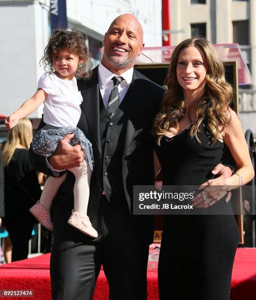 Dwayne Johnson, Lauren Hashian and daughter Jasmine Johnson attend a ceremony honoring him with a star on The Hollywood Walk of Fame on December 13,...