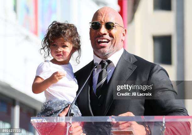 Dwayne Johnson and daughter Jasmine Johnson attend a ceremony honoring him with a star on The Hollywood Walk of Fame on December 13, 2017 in Los...