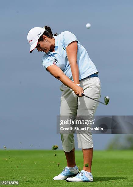 Caroline Rominger of Switzerland plays her approach shot on the fifth hole during the first round of the Evian Masters at the Evian Masters Golf Club...