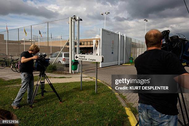 Camera crews film the entrance to the Brugge prison, on July 23, 2009. Three dangerous criminals, were reportedly liberated from the prison by two...