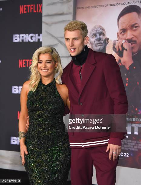 Bebe Rexha and Machine Gun Kelly attend the premiere of Netflix's "Bright" at Regency Village Theatre on December 13, 2017 in Westwood, California.