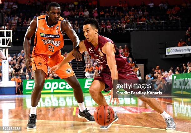 Travis Trice of the Bullets drives to the basket during the round 10 NBL match between the Cairns Taipans and the Brisbane Bullets at Cairns...