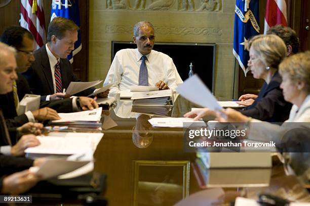 Attorney General Eric Holder in his office getting a briefing from his staff at the United States Justice Department on June 15, 2009 in Washington,...