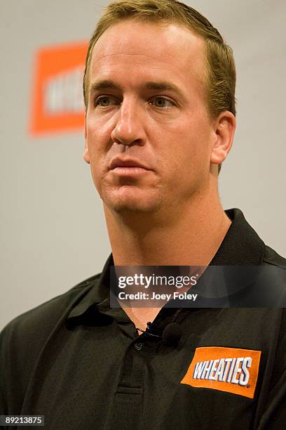 Indianapolis Colts quarterback Peyton Manning talks about the process of creating a new Wheaties breakfast cereal during a press conference at...