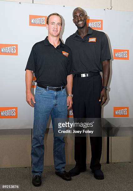 Indianapolis Colts quarterback Peyton Manning and NBA Basketball star Kevin Garnett pose for a photograph after a press conference at Conseco...
