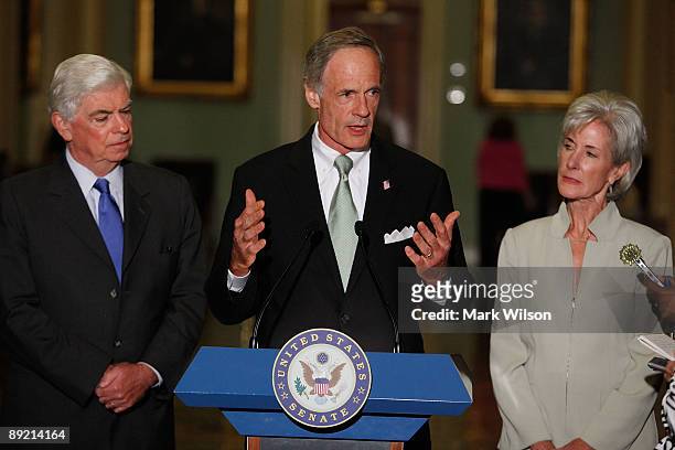 Sen. Christopher Dodd , Sen. Tom Carper and Secretary of Health and Human Services Kathleen Sebelius speak after a meeting at the Capitol on July 23,...