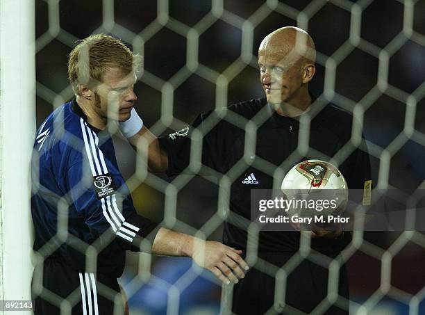 Referee Pierluigi Collina of Italy consoles a dejected Oliver Kahn of Germany after the World Cup Final match between Germany and Brazil played at...