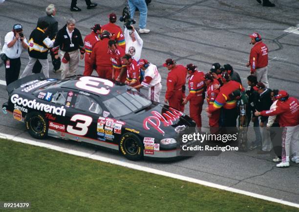 Dale Earnhardt Sr. Driver of the Monte Carlo Chevrolet is congratulated by rival pit crew members after winning the NASCAR Winston Cup Daytona 500 on...