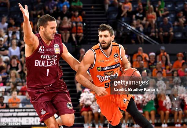 Jarrad Weeks of the Taipans takes on the defence during the round 10 NBL match between the Cairns Taipans and the Brisbane Bullets at Cairns...