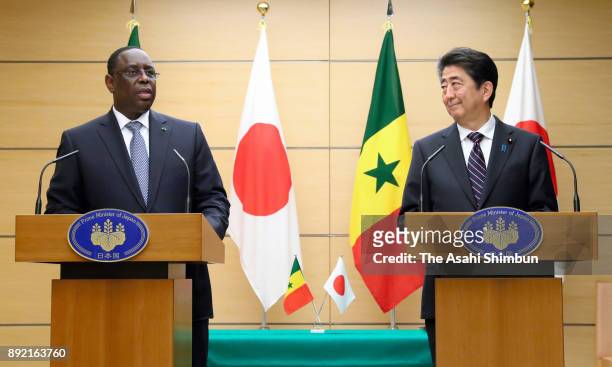 Senegalese President Macky Sall and Japanese Prime Minister Shinzo Abe attend a joint press conference following their meeting at the prime...