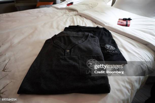 Lalique Group pyjamas sit on the bed in a suite of a Singapore Airlines Ltd. Airbus SE A380 aircraft with refitted cabins during a media tour at...