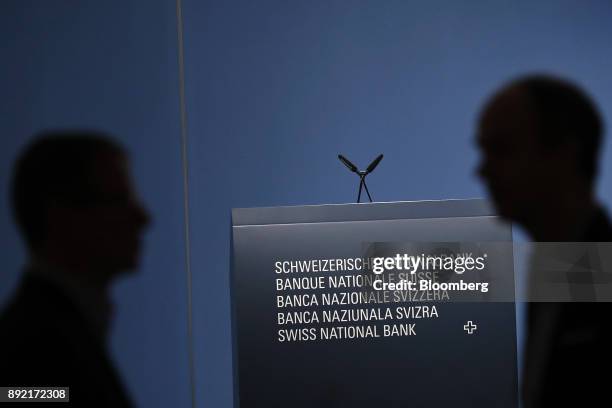 The Swiss National Bank logo sits on a plinth ahead of the bank's rate announcement news conference in Bern, Switzerland, on Thursday, Dec. 14, 2017....