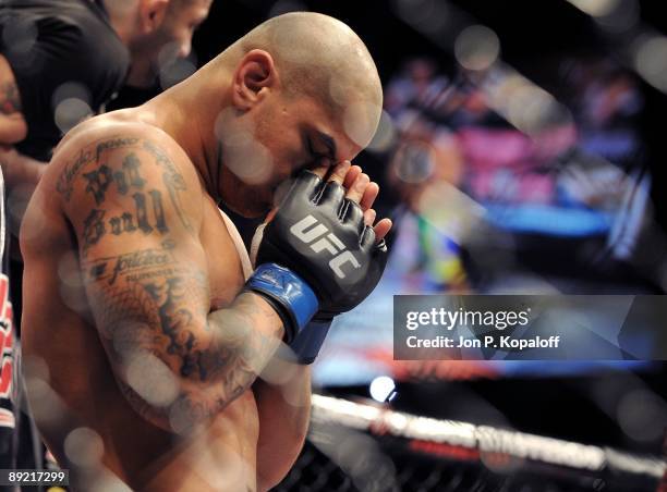Welterweight Thiago Alves prays before his fight against Georges St-Pierre during their Welterweight title bout at UFC 100 the Mandalay Bay Hotel and...