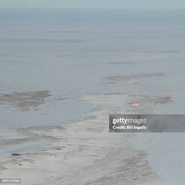 In this handout image provided by NASA, The Soyuz MS-05 spacecraft is seen as it lands with Expedition 53 Commander Randy Bresnik of NASA and Flight...