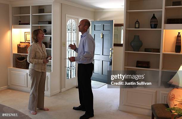 Real estate agents chat as they tour an open house during a brokers tour July 23, 2009 in San Rafael, California. The National Association of...