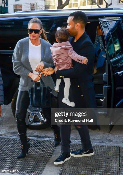 Chrissy Teigen, John Legend, Luna Legend are seen in Soho on December 13, 2017 in New York City.