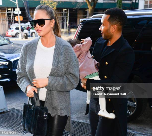 Chrissy Teigen, John Legend, Luna Legend are seen in Soho on December 13, 2017 in New York City.