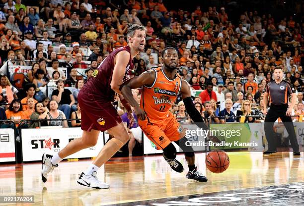 Scoochie Smith of the Taipans takes on the defence during the round 10 NBL match between the Cairns Taipans and the Brisbane Bullets at Cairns...