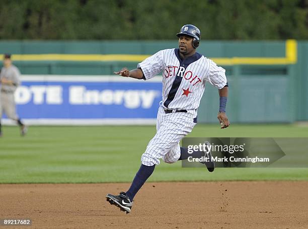 Marcus Thames of the Detroit Tigers runs the bases while wearing a Detroit Stars Negro League Tribute uniform against the Cleveland Indians during...