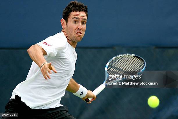 Wayne Odesnik returns a shot to Igor Kunitsyn of Russia during the Indianapolis Tennis Championships on July 23, 2009 at the Indianapolis Tennis...