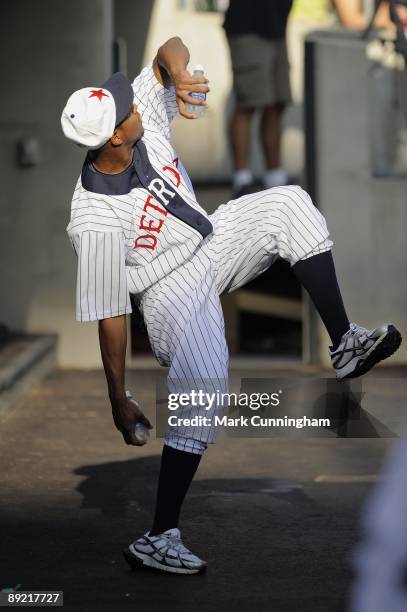 Edwin Jackson of the Detroit Tigers poses in a wind-up while wearing a Detroit Stars Negro League Tribute uniform against the Cleveland Indians...